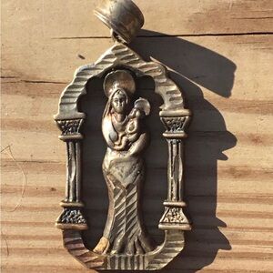 Vintage religious cast metal piece with Madonna and child